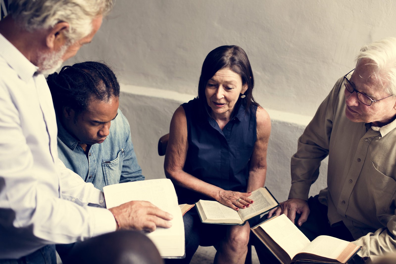 Small group of people in conversation, representing community connection