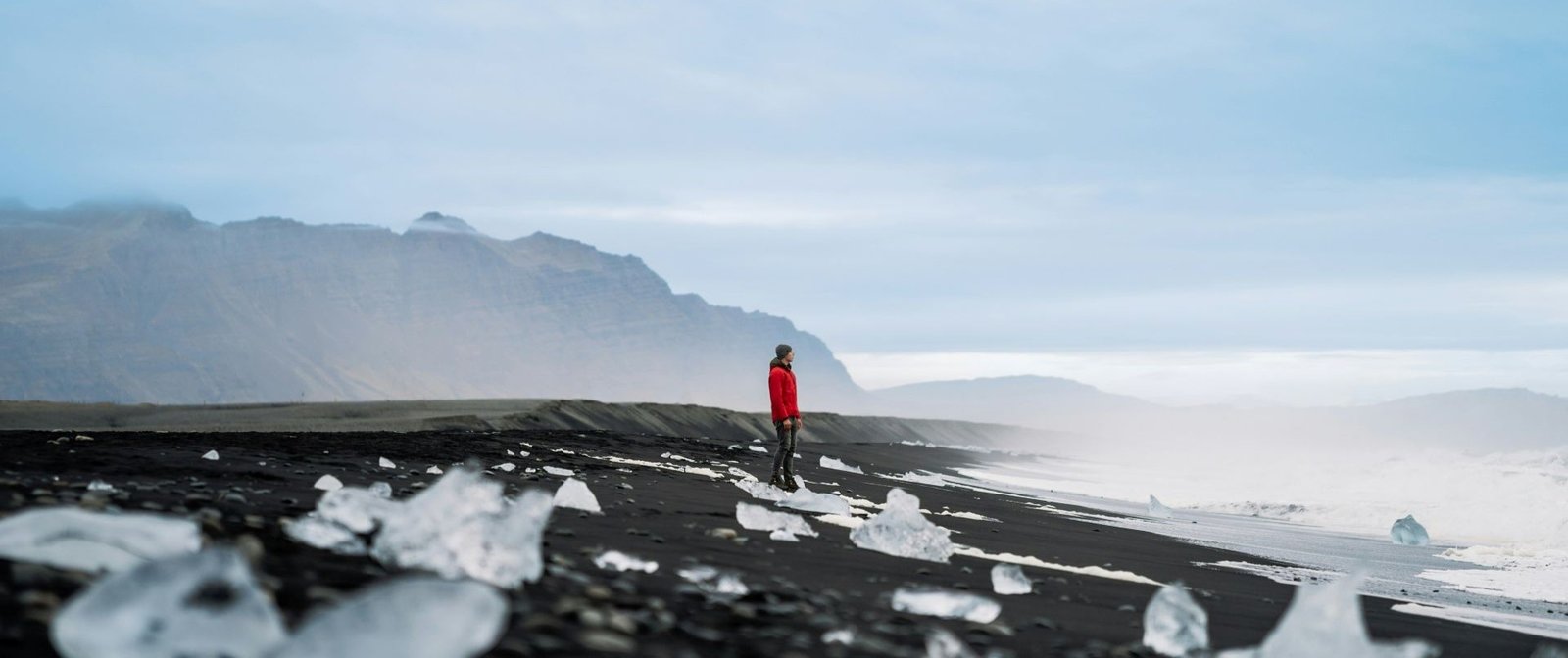 Person looking out at peaceful landscape